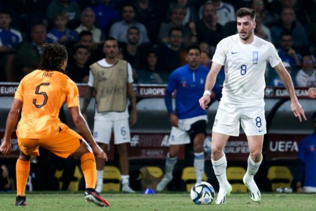 Fotis Ioannidis of Greece (R) in action against Nathan Ake of the Netherlands during the UEFA EURO 2024 group B qualification round match between Greece and the Netherlands in Athens, Greece, 16 October 2023. EPA-EFE/Georgia Panagopoulou (Bologna transfer links)