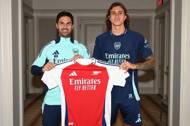 Italy international Riccardo Calafiori with Arsenal coach Mikel Arteta after completing permanent transfer from Bologna.