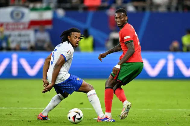 TOPSHOT - France's defender #05 Jules Kounde and Portugal's forward #17 Rafael Leao fight for the ball during the UEFA Euro 2024 quarter-final football match between Portugal and France at the Volksparkstadion in Hamburg on July 5, 2024. (Photo by PATRICIA DE MELO MOREIRA / AFP) (Photo by PATRICIA DE MELO MOREIRA/AFP via Getty Images)