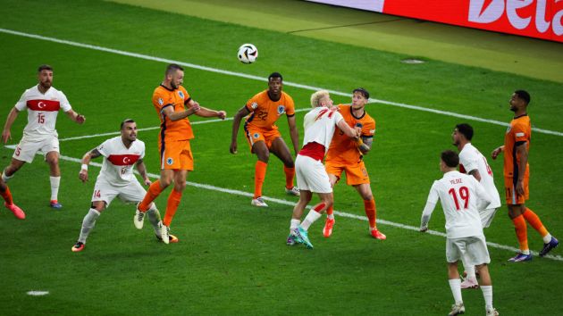 Netherlands' defender #06 Stefan de Vrij heads the ball and scores his team's first goal during the UEFA Euro 2024 quarter-final football match between the Netherlands and Turkey at the Olympiastadion Berlin in Berlin on July 6, 2024. (Photo by Ronny HARTMANN / AFP) (Photo by RONNY HARTMANN/AFP via Getty Images)