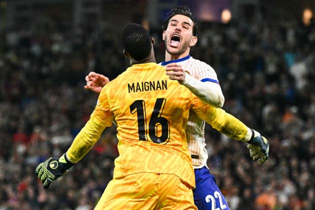 France's defender #22 Theo Hernandez celebrates with France's goalkeeper #16 Mike Maignan after he scored his penalty and qualified France during the UEFA Euro 2024 quarter-final football match between Portugal and France at the Volksparkstadion in Hamburg on July 5, 2024. (Photo by JAVIER SORIANO / AFP) (Photo by JAVIER SORIANO/AFP via Getty Images)