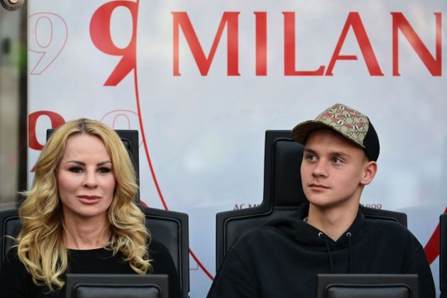 The wife of AC Milan forward Zlatan Ibrahimovic, Helena Seger (L) and their son son Maximilian Ibrahimovic looks on at the start of the Italian Serie A football match between AC Milan and Atalanta Bergamo at the San Siro stadium in Milan on May 15, 2022. (Photo by MIGUEL MEDINA / AFP) (Photo by MIGUEL MEDINA/AFP via Getty Images)