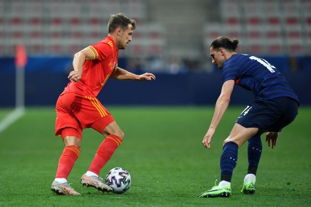 NICE, FRANCE - JUNE 02: Aaron Ramsey of Wales battles for possession with Adrien Rabiot of France during the international friendly match between France and Wales at Allianz Riviera on June 02, 2021 in Nice, France. (Photo by Valerio Pennicino/Getty Images)