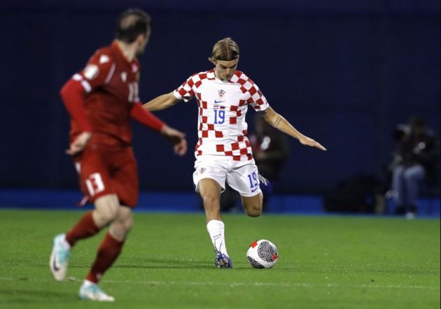 Borna Sosa of Ajax and Croatia (R) in action against Sergei Muradian of Armenia (L) during the UEFA EURO 2024 Group D qualification match between Croatia and Armenia in Zagreb, Croatia, 21 November 2023. EPA-EFE/ANTONIO BAT