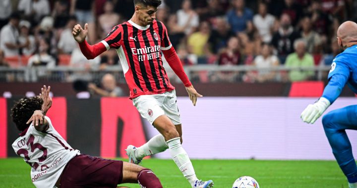 AC Milan's Spanish forward #07 Alvaro Morata (C) attempts to shoot the ball past Torino's Equatorial Guinea defender #23 Saul Basilio Coco-Bassey Oubina during the Italian Serie A football match between AC Milan and Torino at the San Siro Stadium in Milan, on August 17, 2024. (Photo by Piero CRUCIATTI / AFP) (Photo by PIERO CRUCIATTI/AFP via Getty Images)