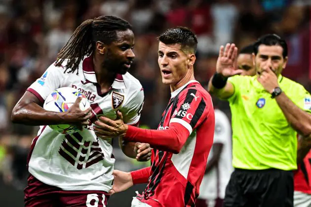 AC Milan's Spanish forward #7 Álvaro Morata (C) argues with Torino's French midfielder #61 Adrien Tameze during the Italian Serie A football match between AC Milan and Torino at the San Siro Stadium in Milan, on August 17, 2024. (Photo by Piero CRUCIATTI / AFP) (Photo by PIERO CRUCIATTI/AFP via Getty Images)