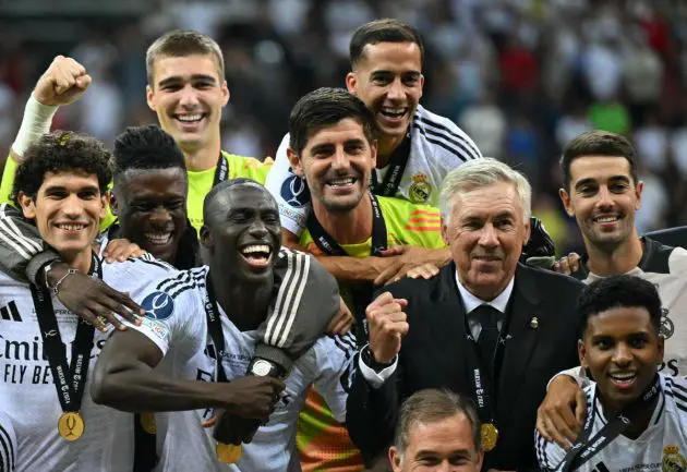 Real Madrid's Italian coach Carlo Ancelotti and players celebrate after the UEFA Super Cup football match between Real Madrid and Atalanta BC in Warsaw, on August 14, 2024. (Photo by Sergei GAPON / AFP) (Photo by SERGEI GAPON/AFP via Getty Images)