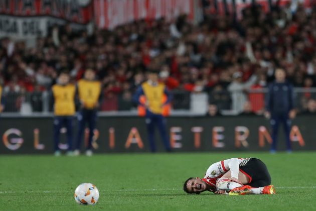 BUENOS AIRES, ARGENTINA - AUGUST 21: Franco Carboni of River Plate lies on the pitch during the Copa CONMEBOL Libertadores 2024 round of 16 second leg match between River Plate and Talleres at Estadio Más Monumental Antonio Vespucio Liberti on August 21, 2024 in Buenos Aires, Argentina. (Photo by Daniel Jayo/Getty Images)