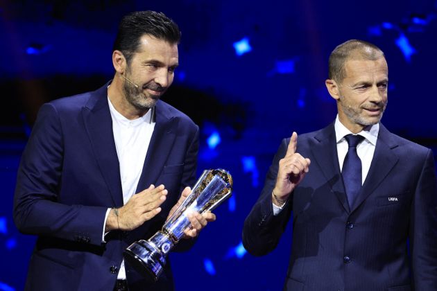 Italy's former goalkeeper Gianluigi Buffon (L) receive the 2024 UEFA President's Award from UEFA President Aleksander Ceferin during the ceremony of the draw for the group stage of the 2024-2025 UEFA Champions League football tournament, at the Grimaldi Forum in Monaco on August 29, 2024. (Photo by Valery HACHE / AFP) (Photo by VALERY HACHE/AFP via Getty Images)