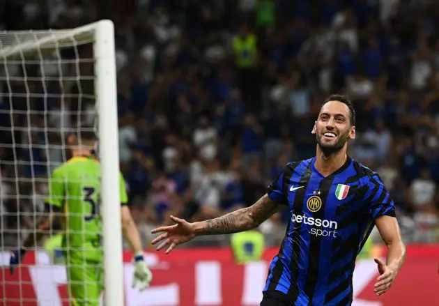 Inter Milan's Turkish midfielder #20 Hakn Calhanoglu celebrates after scoring during the Italian Serie A football match Inter Milan and Lecce at San Siro Stadium in Milan, on August 24, 2024. (Photo by Isabella BONOTTO / AFP) (Photo by ISABELLA BONOTTO/AFP via Getty Images)