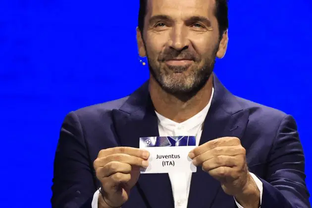 Italy's former goalkeeper Gianluigi Buffon shows the paper slip of Juventus (ITA) during the group stage of the 2024-2025 UEFA Champions League football tournament, at the Grimaldi Forum in Monaco on August 29, 2024. (Photo by Valery HACHE / AFP) (Photo by VALERY HACHE/AFP via Getty Images)