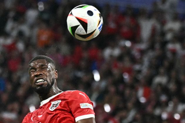 Austria's defender #04 Kevin Danso heads the ball during the UEFA Euro 2024 round of 16 football match between Austria and Turkey at the Leipzig Stadium in Leipzig on July 2, 2024. (Photo by JAVIER SORIANO / AFP) (Photo by JAVIER SORIANO/AFP via Getty Images)