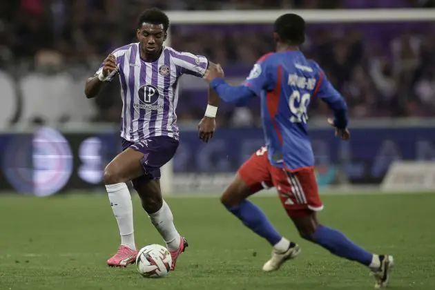 Toulouse's French Cape Verdean defender #06 Logan Costa (L) runs with the ball during the French L1 football match between Toulouse FC and Olympique Lyonnais (OL) at the TFC Stadium in Toulouse, southwestern France, on March 15, 2024. (Photo by Valentine CHAPUIS / AFP) (Photo by VALENTINE CHAPUIS/AFP via Getty Images)