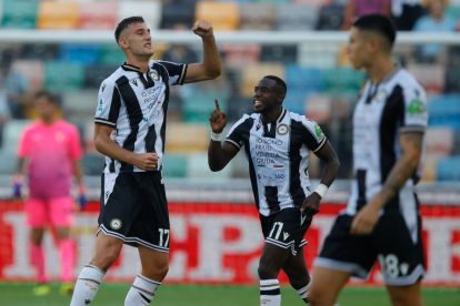 UDINE, ITALY - AUGUST 24: Lorenzo Lucca of Udinese celebrates scoring a goal with teammate Hassane Kamara (#11) during the Serie A match between Udinese and SS Lazio at Stadio Friuli on August 24, 2024 in Udine, Italy. (Photo by Timothy Rogers/Getty Images)