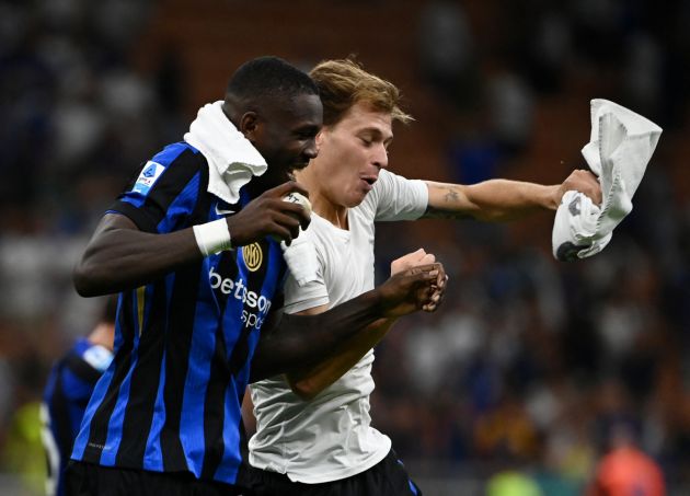 Inter Milan's French forward #9 Marcus Thuram (L) and Inter Milan's Italian midfielder #23 Nicolo' Barella (R) celebrate after winning 2-0 the Italian Serie A football match Inter Milan and Lecce at San Siro Stadium in Milan, on August 24, 2024. (Photo by Isabella BONOTTO / AFP) (Photo by ISABELLA BONOTTO/AFP via Getty Images)