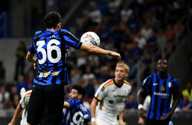 Inter Milan's Italian defender #36 Matteo Darmian hits the ball to score his team's first goal during the Italian Serie A football match Inter Milan and Lecce at San Siro Stadium in Milan, on August 24, 2024. (Photo by Isabella BONOTTO / AFP) (Photo by ISABELLA BONOTTO/AFP via Getty Images)