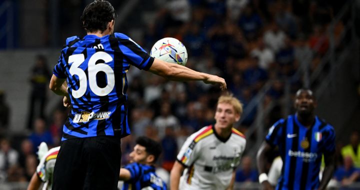 Inter Milan's Italian defender #36 Matteo Darmian hits the ball to score his team's first goal during the Italian Serie A football match Inter Milan and Lecce at San Siro Stadium in Milan, on August 24, 2024. (Photo by Isabella BONOTTO / AFP) (Photo by ISABELLA BONOTTO/AFP via Getty Images)