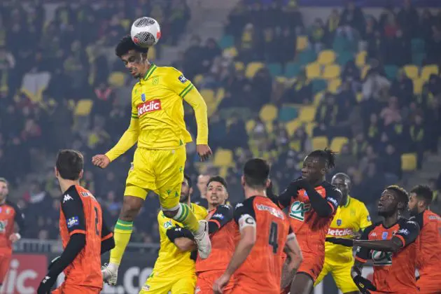 Nantes' French defender #02 Nathan Zeze (up) heads the ball during the French Cup round of 32 football match between FC Nantes and Stade Lavallois FC at La Beaujoire stadium in Nantes, western France, on January 20, 2024. (Photo by Damien Meyer / AFP) (Photo by DAMIEN MEYER/AFP via Getty Images)