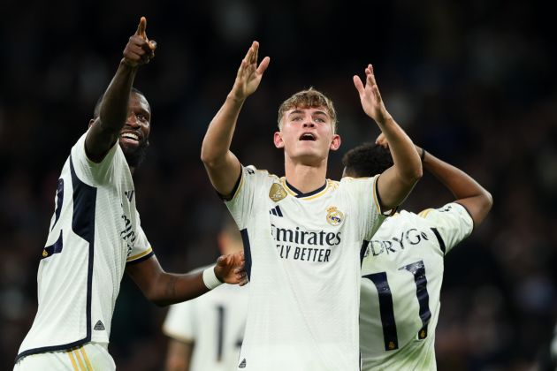 MADRID, SPAIN - NOVEMBER 29: Nico Paz of Real Madrid celebrates with teammate Antonio Rudiger after scoring the team's third goal during the UEFA Champions League match between Real Madrid and SSC Napoli at Estadio Santiago Bernabeu on November 29, 2023 in Madrid, Spain. (Photo by Florencia Tan Jun/Getty Images)