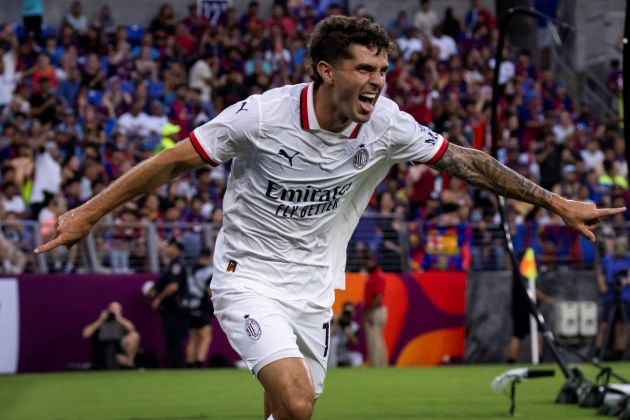 AC Milan's American forward #11 Christian Pulisic celebrates after scoring a goal during the pre-season club friendly football match between Barcelona and AC Milan at M&T Bank Stadium in Baltimore, Maryland, August 6, 2024. (Photo by SAMUEL CORUM / AFP) (Photo by SAMUEL CORUM/AFP via Getty Images)