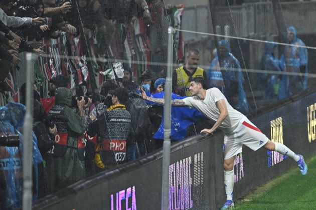 Italy's defender #21 Alessandro Bastoni gives his shirt to the fans after the UEFA Nations League, League A, Group A2 football match Israel vs Italy at the Bozsik Arena in Budapest, Hungary, on September 9, 2024. (Photo by Attila KISBENEDEK / AFP) (Photo by ATTILA KISBENEDEK/AFP via Getty Images)