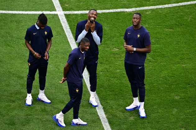 (From L) France's midfielder #06 Eduardo Camavinga, France's forward #11 Ousmane Dembele, France's forward #15 Marcus Thuram and France's defender #24 Ibrahima Konate stand on the pitch prior to the UEFA Euro 2024 semi-final football match between Spain and France at the Munich Football Arena in Munich on July 9, 2024. (Photo by Tobias SCHWARZ / AFP) (Photo by TOBIAS SCHWARZ/AFP via Getty Images)