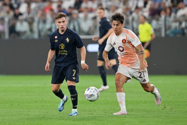 TURIN, ITALY - SEPTEMBER 01: Francisco Conceicao of Juventus and Paulo Dybala of AS Roma battle for possession with Paulo Dybala of AS Roma during the Serie A match between Juventus and AS Roma at Allianz Stadium on September 01, 2024 in Turin, Italy. (Photo by Chris Ricco/Getty Images)