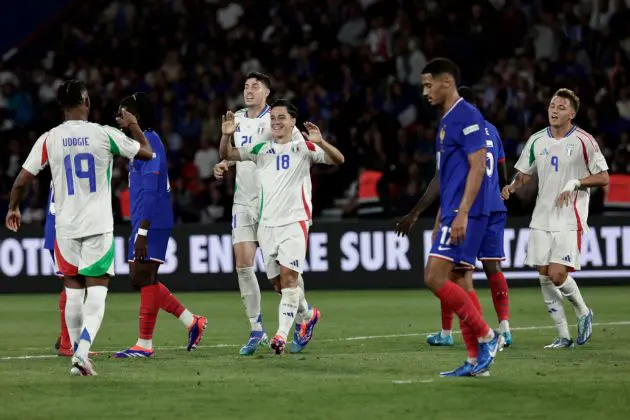 Italy's forward #18 Giacomo Raspadori celebrates with teammates scoring his team's third goal during the UEFA Nations League Group A2 football match between France and Italy at the Parc des Princes in Paris on September 6, 2024. (Photo by STEPHANE DE SAKUTIN / AFP) (Photo by STEPHANE DE SAKUTIN/AFP via Getty Images)