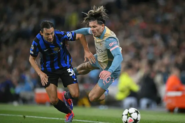 Inter Milan's Italian defender #36 Matteo Darmian (L) fouls Manchester City's English midfielder #10 Jack Grealish (R) during the UEFA Champions League, league phase football match between Manchester City and Inter Milan at the Etihad stadium, in Manchester, north-west England, on September 18, 2024 (Photo by Oli SCARFF / AFP) (Photo by OLI SCARFF/AFP via Getty Images)