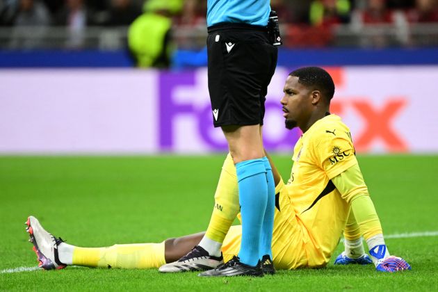 AC Milan's French goalkeeper #16 Mike Maignan sits on the pitch during the UEFA Champions League 1st round day 1 football match between AC Milan and Liverpool FC at the San Siro stadium in Milan on September 17, 2024. (Photo by PIERO CRUCIATTI / AFP) (Photo by PIERO CRUCIATTI/AFP via Getty Images)