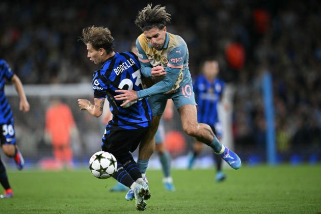 Inter Milan's Italian midfielder #23 Nicolo Barella (L) fouls Manchester City's English midfielder #10 Jack Grealish (R) during the UEFA Champions League, league phase football match between Manchester City and Inter Milan at the Etihad stadium, in Manchester, north-west England, on September 18, 2024 (Photo by Oli SCARFF / AFP) (Photo by OLI SCARFF/AFP via Getty Images)