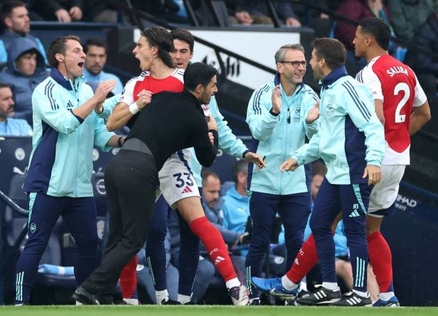 MANCHESTER, ENGLAND - SEPTEMBER 22: Riccardo Calafiori of Arsenal celebrates scoring his team's first goal with Mikel Arteta, Manager of Arsenal, during the Premier League match between Manchester City FC and Arsenal FC at Etihad Stadium on September 22, 2024 in Manchester, England. (Photo by Carl Recine/Getty Images)