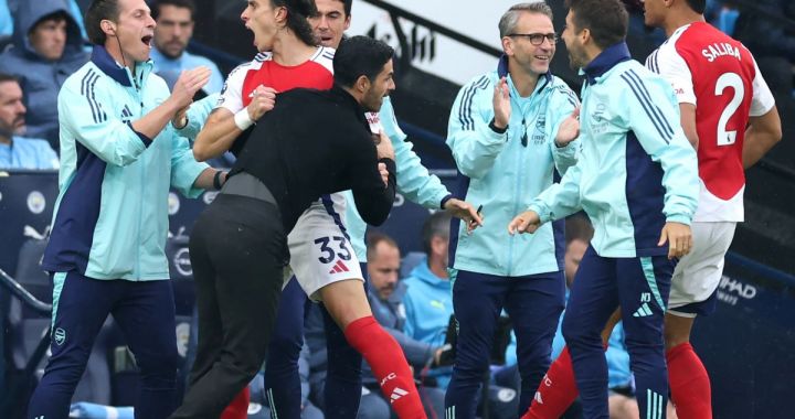 MANCHESTER, ENGLAND - SEPTEMBER 22: Riccardo Calafiori of Arsenal celebrates scoring his team's first goal with Mikel Arteta, Manager of Arsenal, during the Premier League match between Manchester City FC and Arsenal FC at Etihad Stadium on September 22, 2024 in Manchester, England. (Photo by Carl Recine/Getty Images)