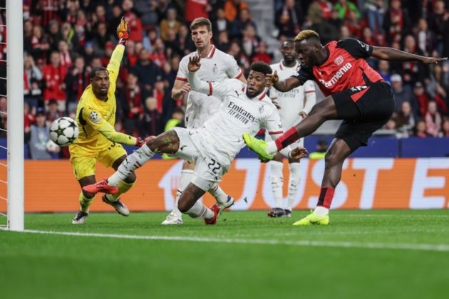 Victor Boniface of Leverkusen (R) scores the 1-0 opening goal during the UEFA Champions League match between Bayer Leverkusen and AC Milan in Leverkusen, Germany, 01 October 2024. EPA-EFE/CHRISTOPHER NEUNDORF