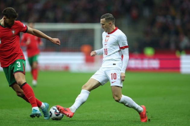 Piotr Zielinski of Serie A side Inter in action for Poland against Ruben Dias (L) of Portugal during the UEFA Nations League group A1 soccer match between Portugal and Poland, in Warsaw, Poland, 12 October 2024 EPA-EFE/Leszek Szymanski POLAND OUT