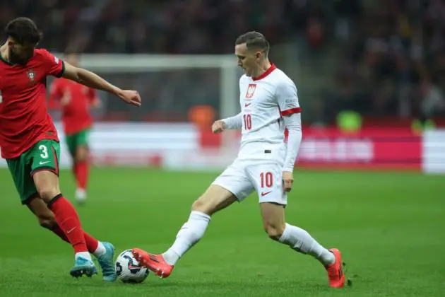 Piotr Zielinski of Serie A side Inter in action for Poland against Ruben Dias (L) of Portugal during the UEFA Nations League group A1 soccer match between Portugal and Poland, in Warsaw, Poland, 12 October 2024 EPA-EFE/Leszek Szymanski POLAND OUT