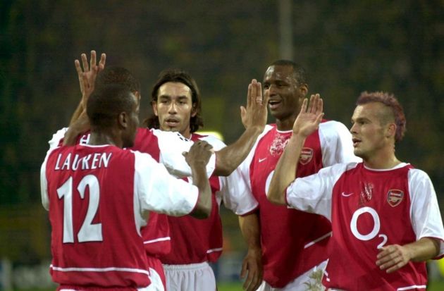 DOR03 - 20021030 - DORTMUND, GERMANY : (from left) Arsenal London's players Lauren, Thierry Henry (hidden), Robert Pires, Patrick Viery and Fredrik Ljungberg celebrate after Therry Henry scored the 0-1 lead for his team during the Champions League soccer match Borussia Dortmund vs Arsenal London in Dortmund, Wednesday 30 October 2002. EPA PHOTO DPA / ACHIM SCHEIDEMANN /th/h fob