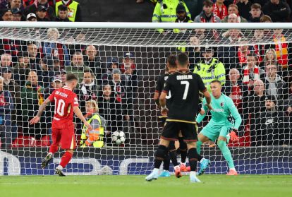 LIVERPOOL, ENGLAND - OCTOBER 02: Alexis Mac Allister of Liverpool scores his team's first goal during the UEFA Champions League 2024/25 League Phase MD2 match between Liverpool FC and Bologna FC 1909 at Anfield on October 02, 2024 in Liverpool, England. (Photo by Carl Recine/Getty Images)