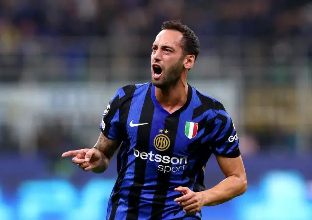 MILAN, ITALY - OCTOBER 01: Hakan Calhanoglu of FC Internazionale celebrates scoring his team's first goal during the UEFA Champions League 2024/25 League Phase MD2 match between FC Internazionale Milano and FK Crvena Zvezda at Stadio San Siro on October 01, 2024 in Milan, Italy. (Photo by Marco Luzzani/Getty Images)