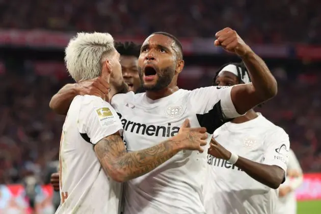 MUNICH, GERMANY - SEPTEMBER 28: Robert Andrich of Bayer 04 Leverkusen celebrates with teammate Jonathan Tah after scoring his team's first goal during the Bundesliga match between FC Bayern München and Bayer 04 Leverkusen at Allianz Arena on September 28, 2024 in Munich, Germany. (Photo by Alexander Hassenstein/Getty Images)