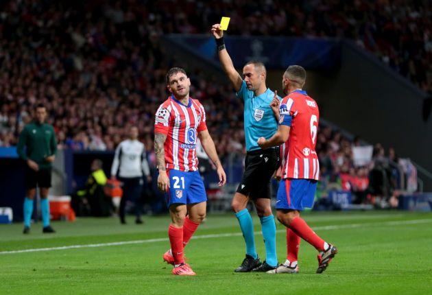 MADRID, SPAIN - OCTOBER 23: Javi Galan of Atletico de Madrid is shown a yellow card by Referee Marco Guida during the UEFA Champions League 2024/25 League Phase MD3 match between Atletico de Madrid and LOSC Lille at Estadio Civitas Metropolitano on October 23, 2024 in Madrid, Spain. (Photo by Florencia Tan Jun/Getty Images)