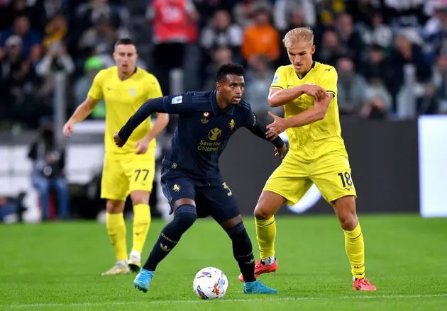 TURIN, ITALY - OCTOBER 19: Juan Cabal of Juventus on the ball whilst under pressure from Gustav Isaksen of Lazio during the Serie A match between Juventus and SS Lazio at on October 19, 2024 in Turin, Italy. (Photo by Valerio Pennicino/Getty Images)