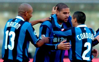 epa00929175 Brazilian forward Leite Ribeiro Adriano (C) of Internazionale FC Milano is congratulated by teammates after scoring against Chievo Verona during their Italian Serie A soccer match in Verona' s Marc'Antonio Bentegodi stadium, which is closed to spectators, on Sunday 11 February 2007.  Play in Italy's first division Serie A resumed on Sunday with spectators allowed into just five of the 10 matches. Milan's San Siro-Giuseppe Meazza stadium was open only to AC Milan's 37,000 season ticket holders. The rest took place behind closed doors - the result of a tough anti-hooligan plan approved by the government in response to the death of policeman Filippo Raciti during rioting at a Serie A match last week.  EPA/STEFANO RACCAMARI