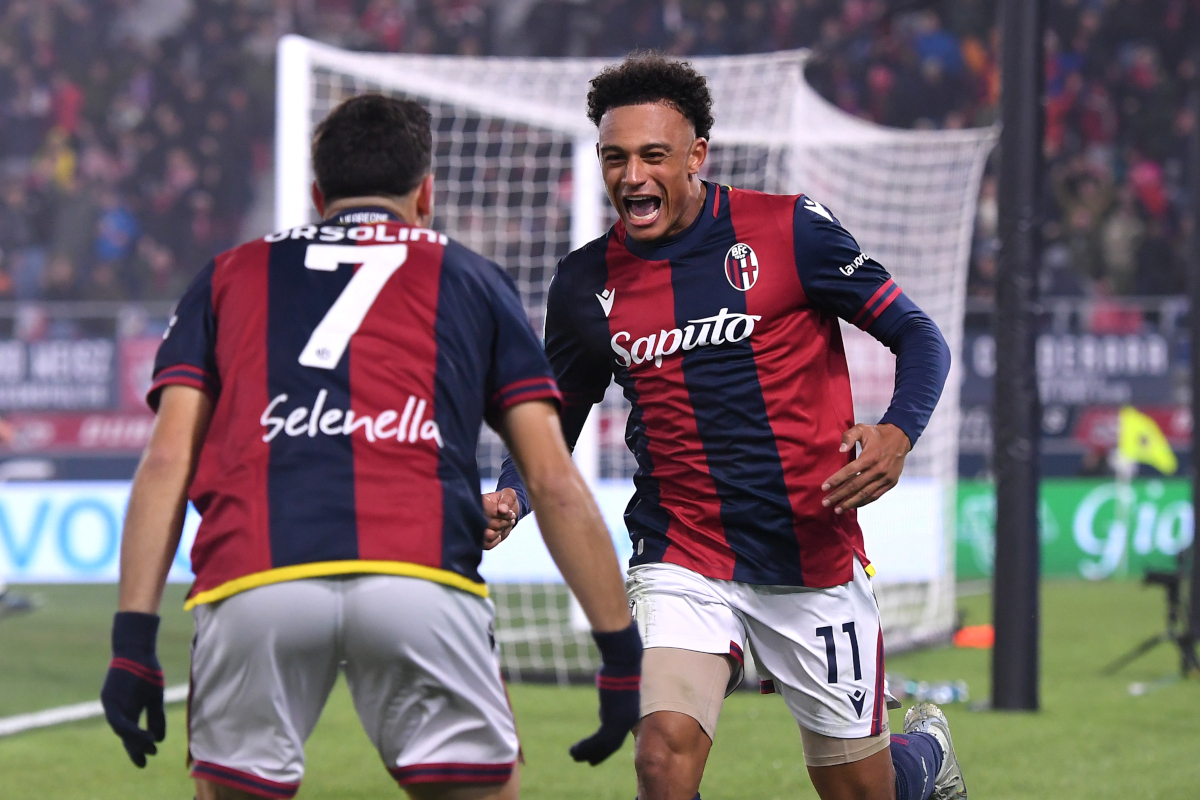 BOLOGNA, ITALY - NOVEMBER 30: Dan Ndoye of Bologna celebrates scoring his team's third goal with teammate Riccardo Orsolini during the Serie A match between Bologna and Venezia at Stadio Renato Dall'Ara on November 30, 2024 in Bologna, Italy. (Photo by Alessandro Sabattini/Getty Images)