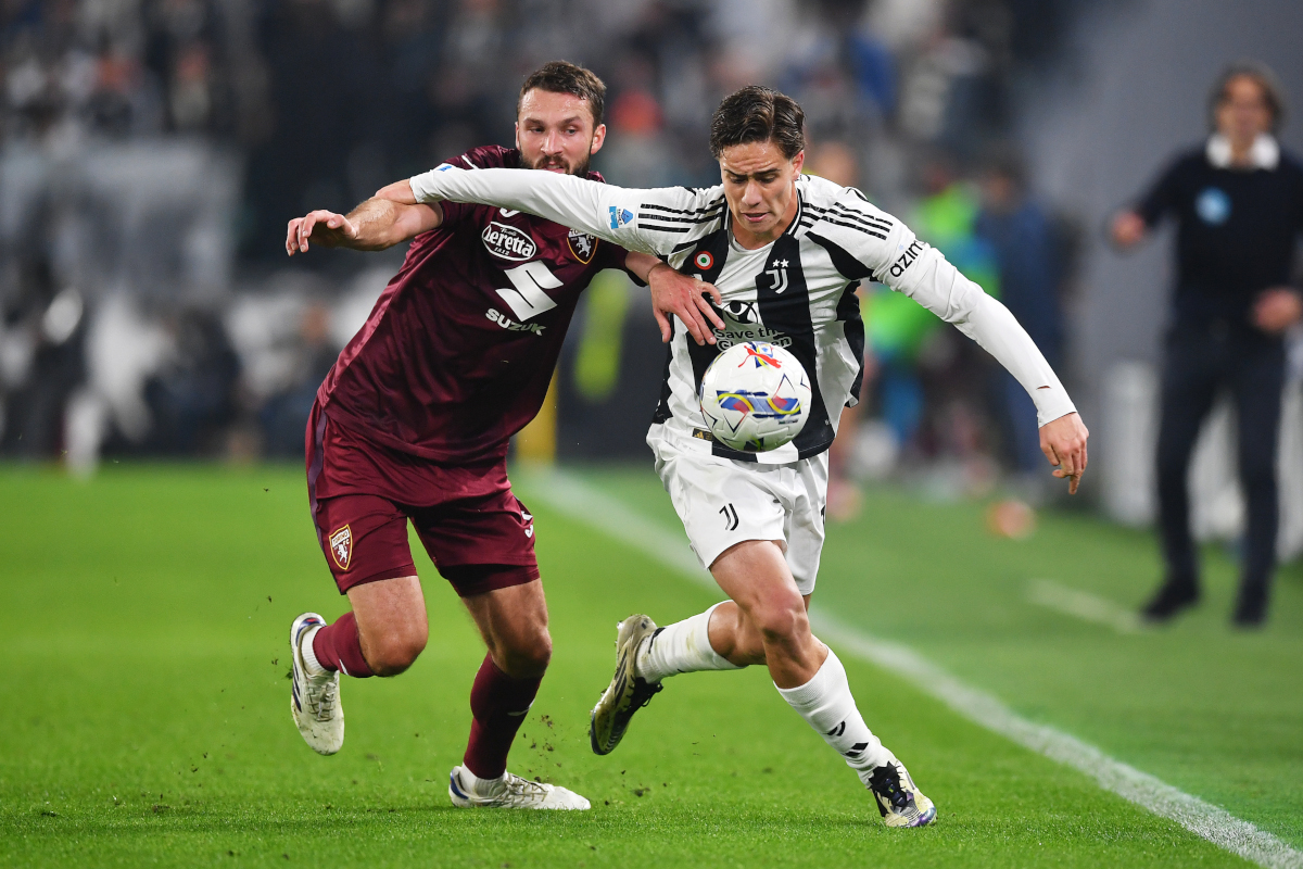 TURIN, ITALY - NOVEMBER 09: Sebastian Walukiewicz of Torino battles for possession with Kenan Yildiz of Juventus during the Serie A match between Juventus and Torino at Juventus Stadium on November 09, 2024 in Turin, Italy. (Photo by Valerio Pennicino/Getty Images)