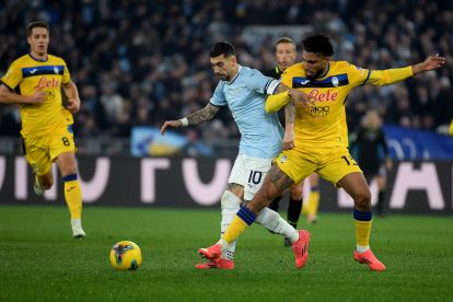 ROME, ITALY - DECEMBER 28: Mattia Zaccagni of SS Lazio compete for the ball with Ederson of Atalanta during the Serie match between Lazio and Atalanta at Stadio Olimpico on December 28, 2024 in Rome, Italy. (Photo by Marco Rosi - SS Lazio/Getty Images)