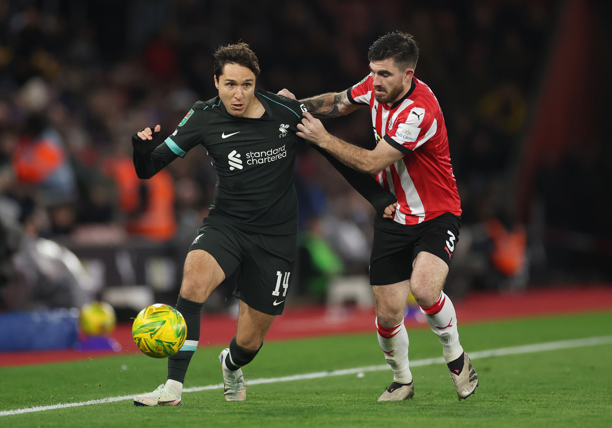 Federico Chiesa of Liverpool is challenged by Ryan Manning of Southampton during the Carabao Cup Quarter Final match between Southampton and Liverpool at St Mary's Stadium on December 18, 2024 in Southampton, England. (Photo by Michael Steele/Getty Images)