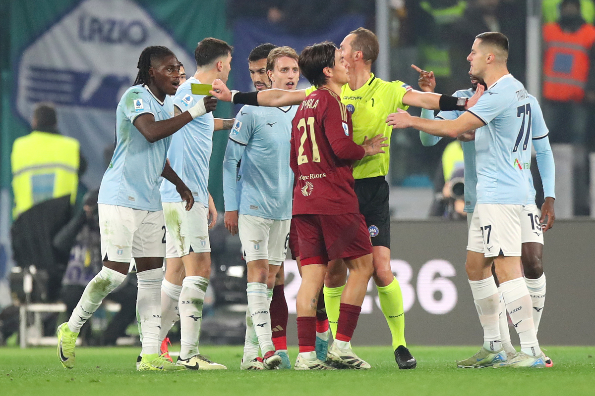 ROME, ITALY - JANUARY 05: Loum Tchaouna of Lazio reacts with Paulo Dybala of AS Roma during the Serie A match between AS Roma and SS Lazio at Stadio Olimpico on January 05, 2025 in Rome, Italy. (Photo by Paolo Bruno/Getty Images)