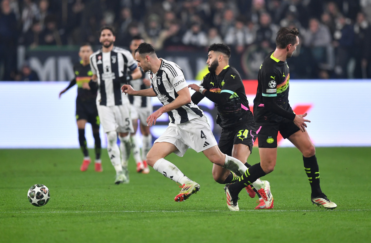 TURIN, ITALY - FEBRUARY 11: Federico Gatti of Juventus is challenged by Ismael Saibari of PSV Eindhoven during the UEFA Champions League 2024/25 League Knockout Play-off first leg match between Juventus and PSV at Allianz Stadium on February 11, 2025 in Turin, Italy. (Photo by Valerio Pennicino/Getty Images)