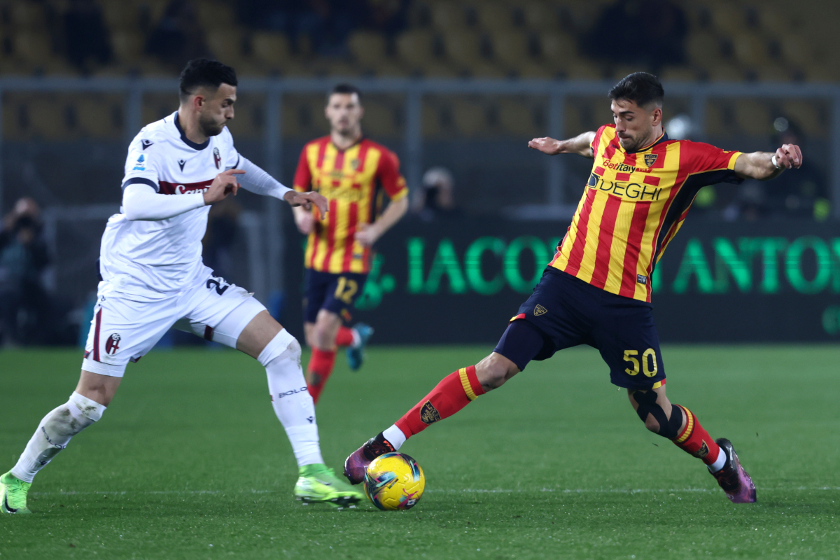 LECCE, ITALY - FEBRUARY 09: Santiago Pierotti of Lecce competes for the ball with Charalampos Lykogiannis of Bologna during the Serie A match between Lecce and Bologna at Stadio Via del Mare on February 09, 2025 in Lecce, Italy. (Photo by Maurizio Lagana/Getty Images)